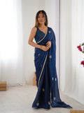 Star Teal Blue Georgette Saree with Silver Floral Embellishments and Gold Border