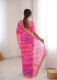 Woman wearing a pink saree with a white background Glanzavi