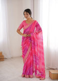Woman wearing a pink saree with a white background Glanzavi