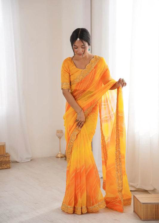 Woman wearing a bright orange saree with a white background Glanzavi