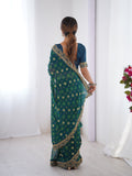 Teal Blue Printed Georgette Saree Gold Embroidered Border
