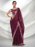 Woman wearing a purple saree with silver border on a white background Glanzavi