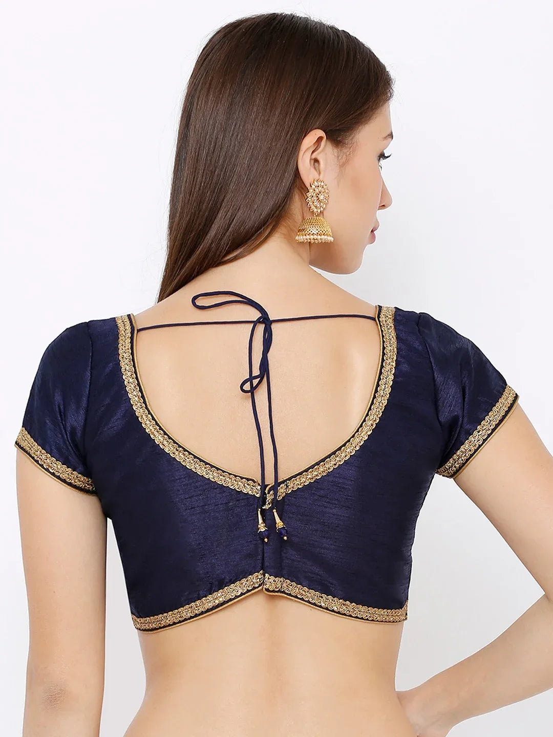 Navy blue blouse with gold detailing on a plain background Glanzavi