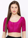 Woman wearing a bright pink blouse against a white background Glanzavi