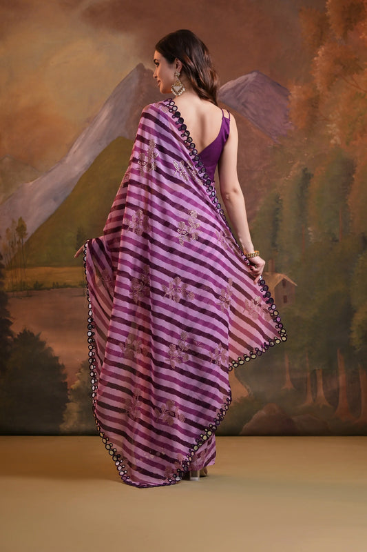 Woman in a purple saree with a scenic background Glanzavi