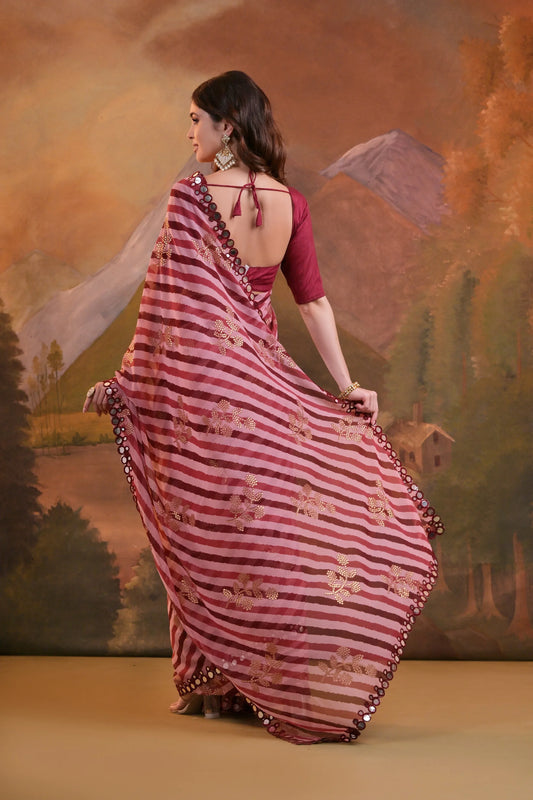 Woman in a red and white striped saree with a scenic background Glanzavi