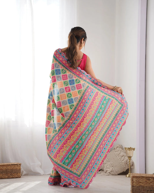 Woman wearing a colorful patterned saree in a bright room Glanzavi