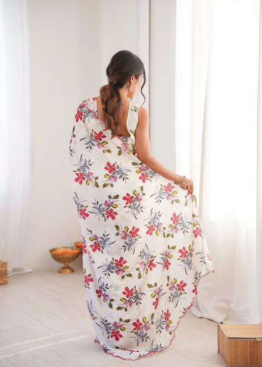 Woman wearing a floral dress in a minimal indoor setting Glanzavi