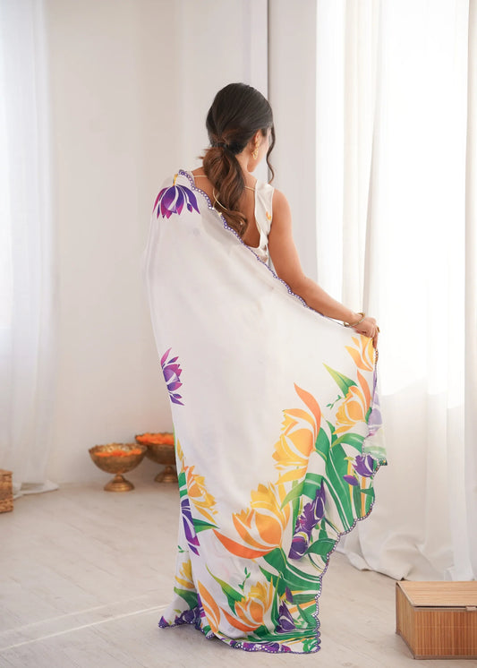 Woman wearing a floral saree in a minimal indoor setting Glanzavi