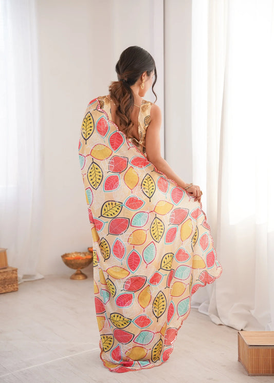 Woman wearing a colorful leaf-patterned dress in a bright room Glanzavi.