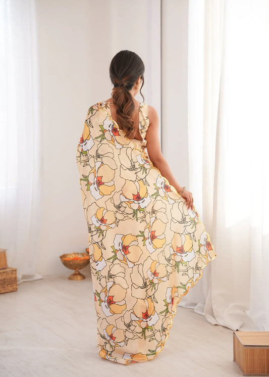 Woman wearing a floral dress in a bright room with white curtains Glanzavi.