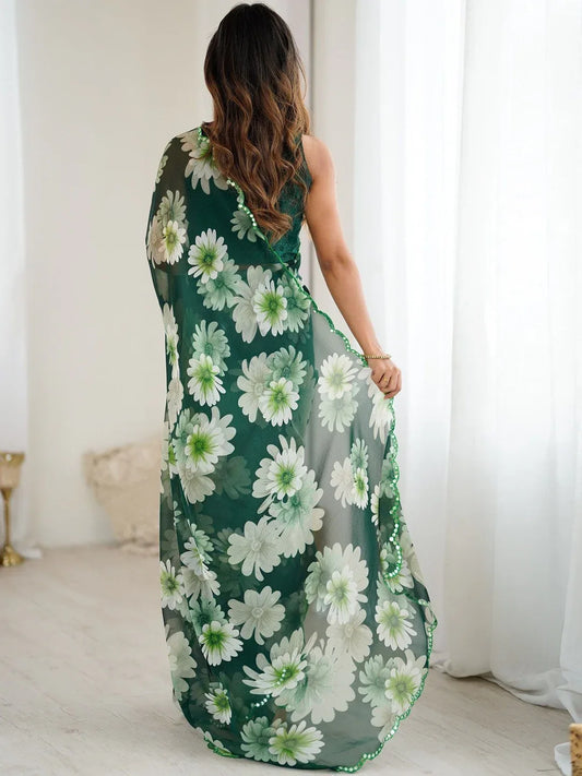 Woman wearing a green floral dress in a bright room Glanzavi.