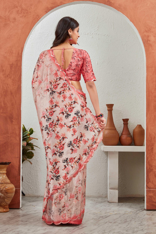 Woman wearing a floral saree in a room with decorative vases Glanzavi