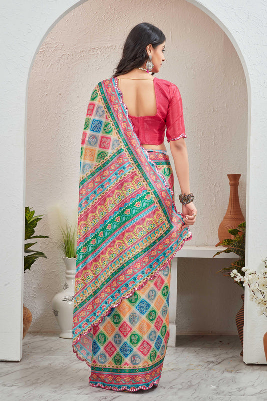 Woman wearing a colorful saree with a pink blouse in an indoor setting Glanzavi