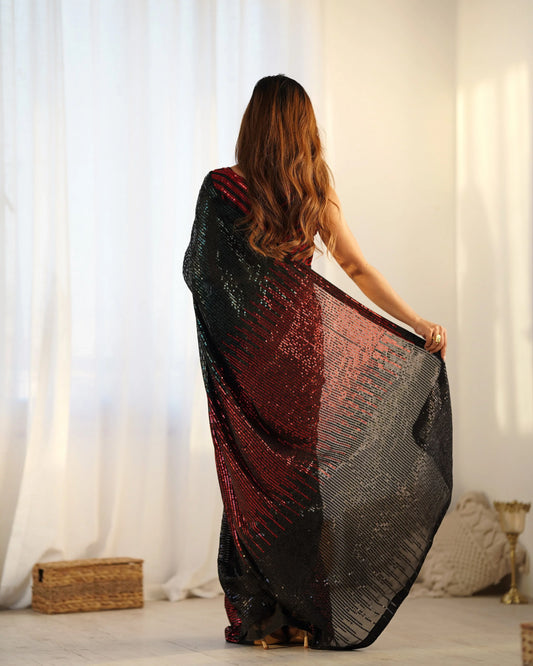 Woman holding a black and red patterned fabric in a room with white curtains and a basket Glanzavi