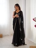Star Black Georgette Saree with Silver Floral Embellishments and Gold Border