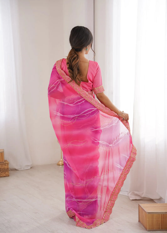 Woman wearing a pink saree with a white background Glanzavi