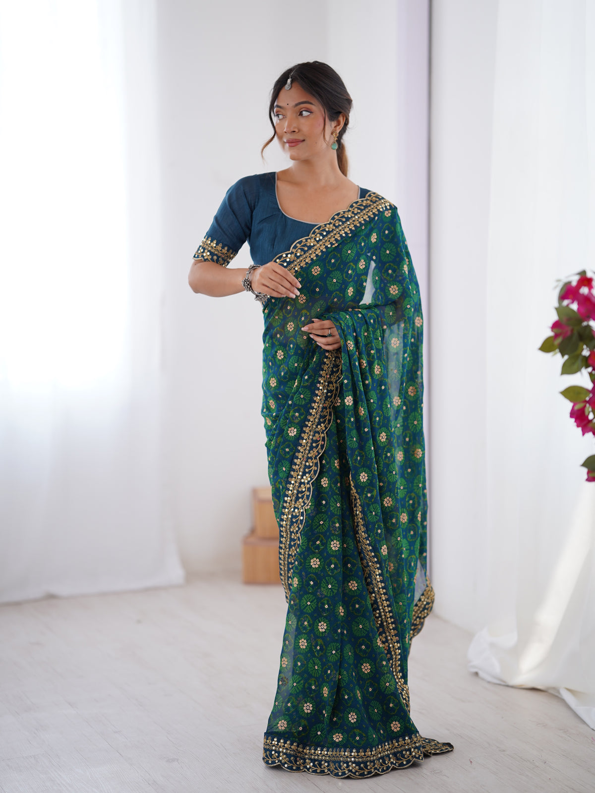Teal Blue Printed Georgette Saree Gold Embroidered Border