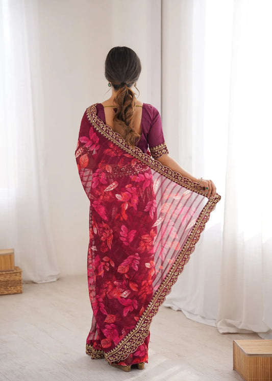Woman wearing a red floral saree with a white background Glanzavi